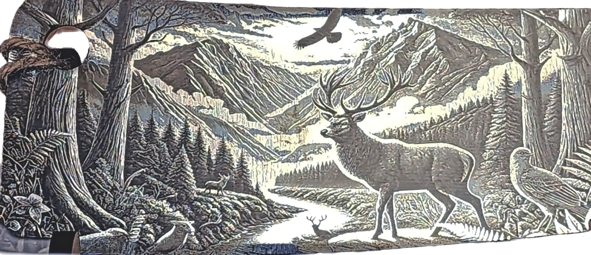 Hunter’s Sunrise cleaver — engraving detail (stag/bush) — Aroha Artisan NZ