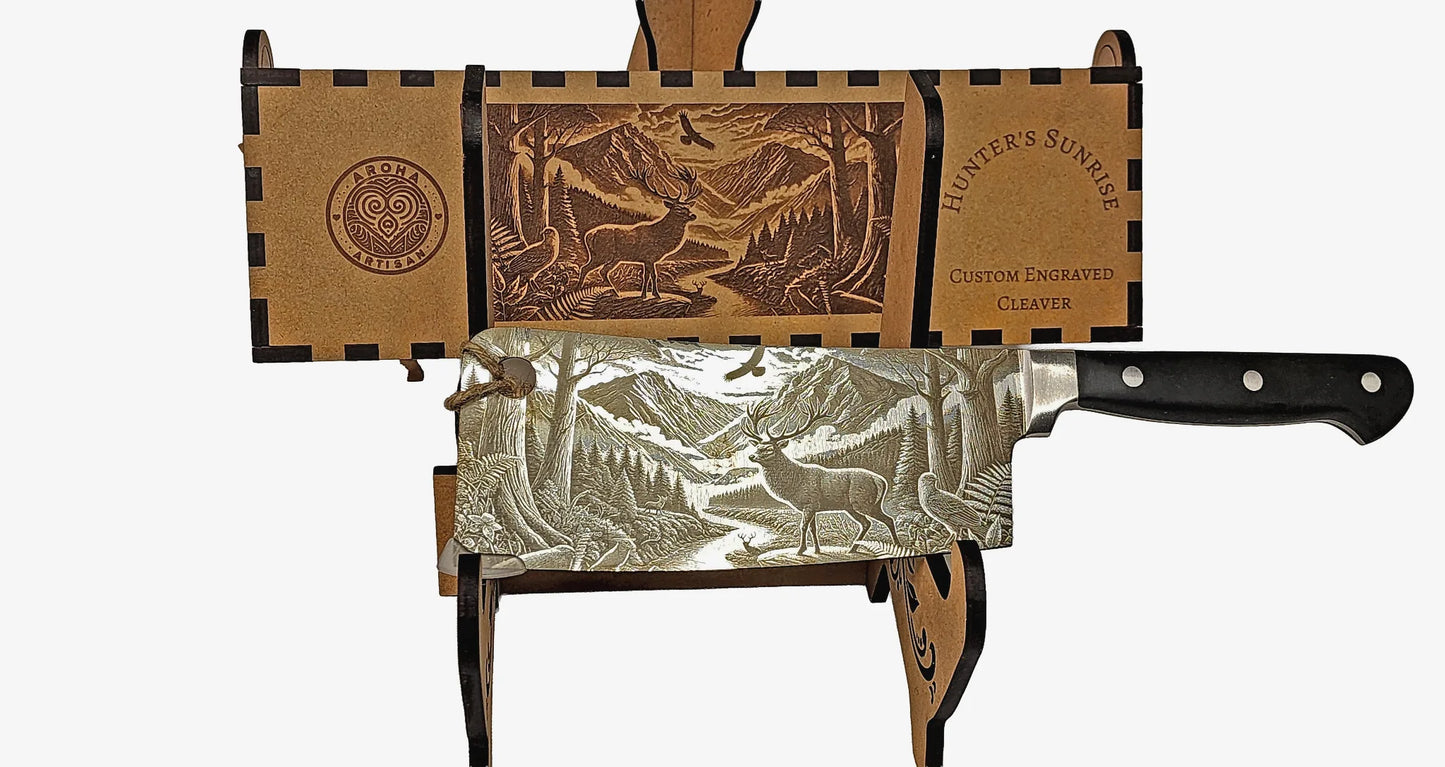 Laser-engraved stainless cleaver — Hunter’s Sunrise — stag at sunrise native bush — engraved both sides — gift-ready MDF box — Aroha Artisan NZ