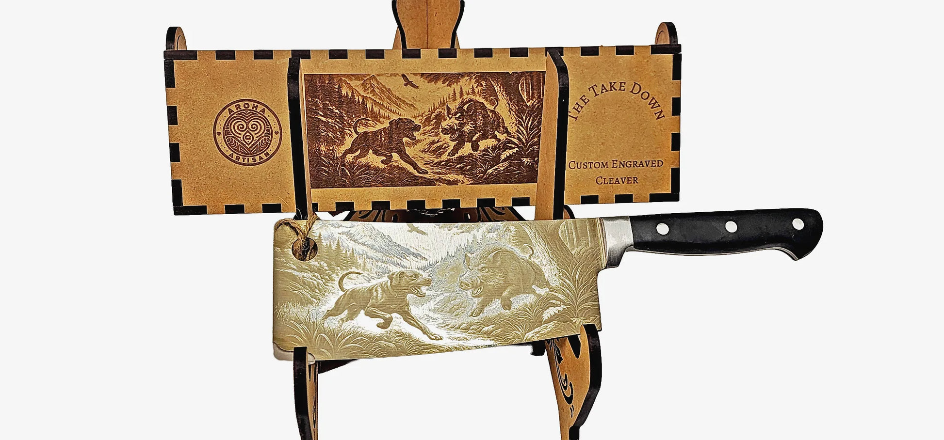 Laser-engraved stainless cleaver — The Take Down — wild boar bush scene — engraved both sides — gift-ready MDF box — Aroha Artisan NZ