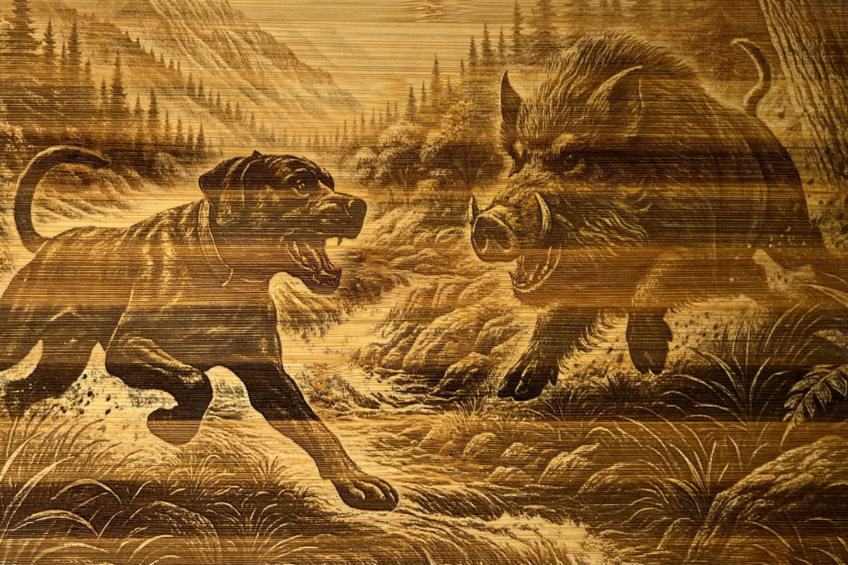 Close-up of The Take Down: One-Dog Edition bamboo board, showing the engraved one-dog face-off scene and natural grain.