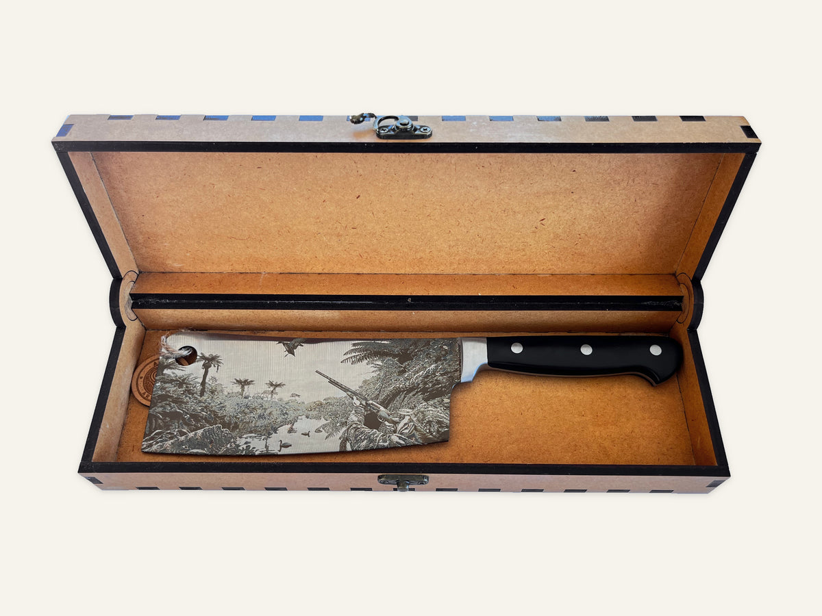 Call of the Wild three-rivet cleaver inside its open engraved MDF presentation box