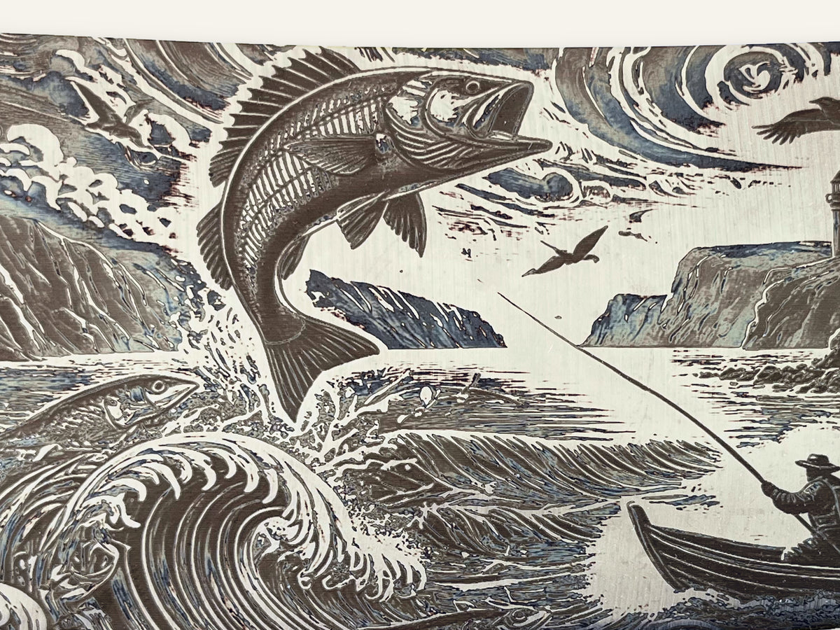 Close-up of the photographed engraving on the Fishing Spirit cleaver