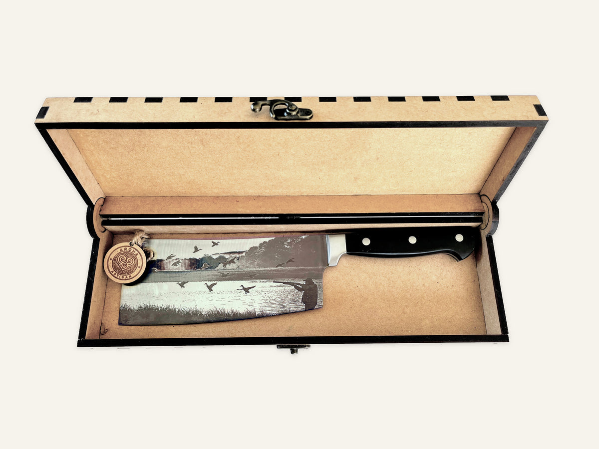 Flight of Steel three-rivet cleaver inside its open engraved MDF presentation box