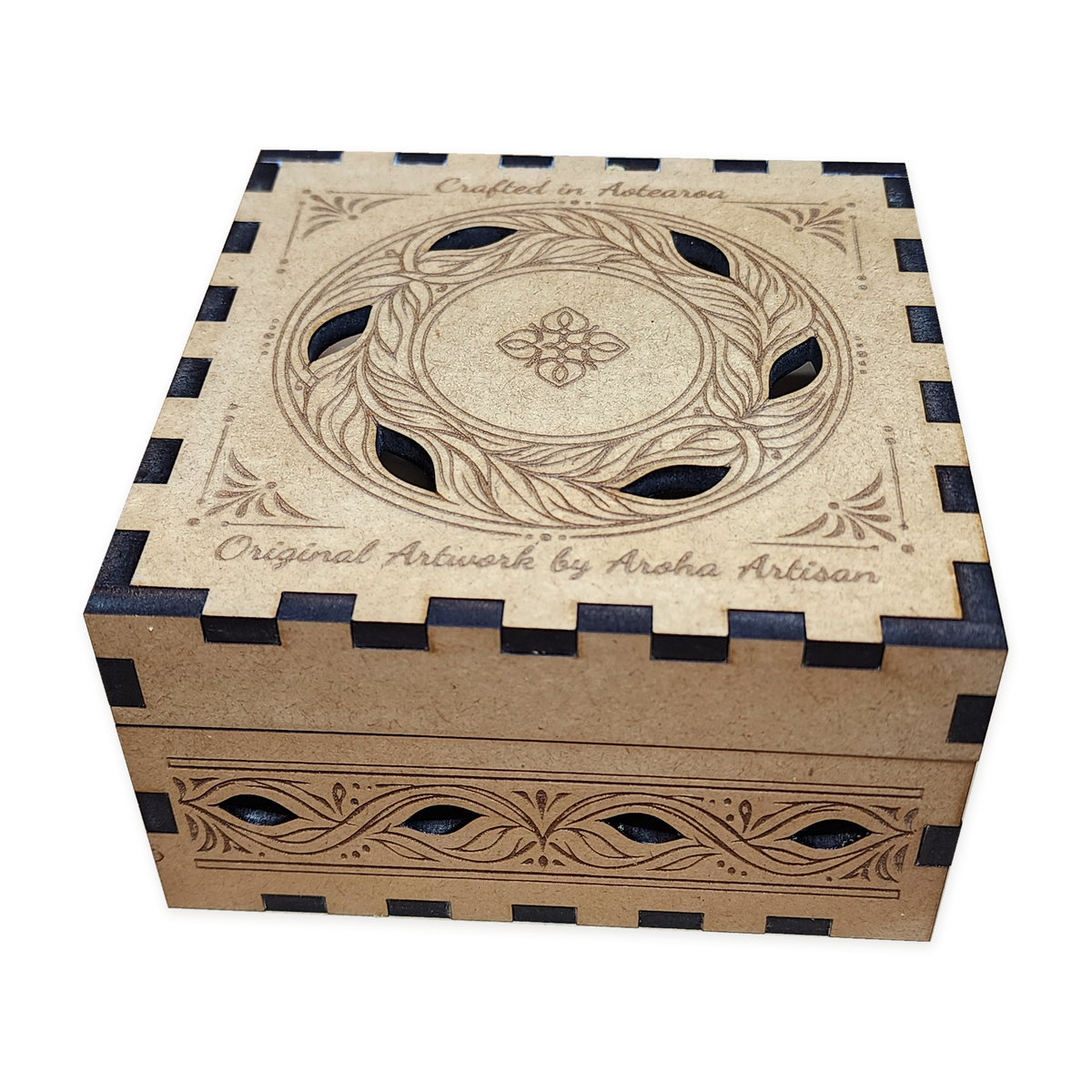 Closed MDF box with an engraved leaf-wreath lid and decorative cut-outs