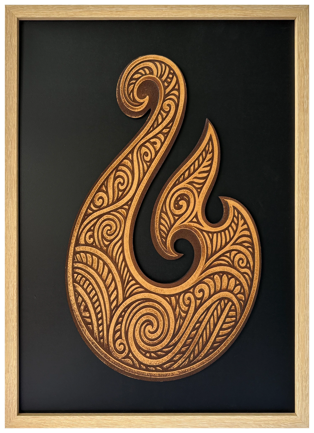 Hei Matou engraved cutout artwork against a black background in an A2-size Ashwood-finish wood-grain frame