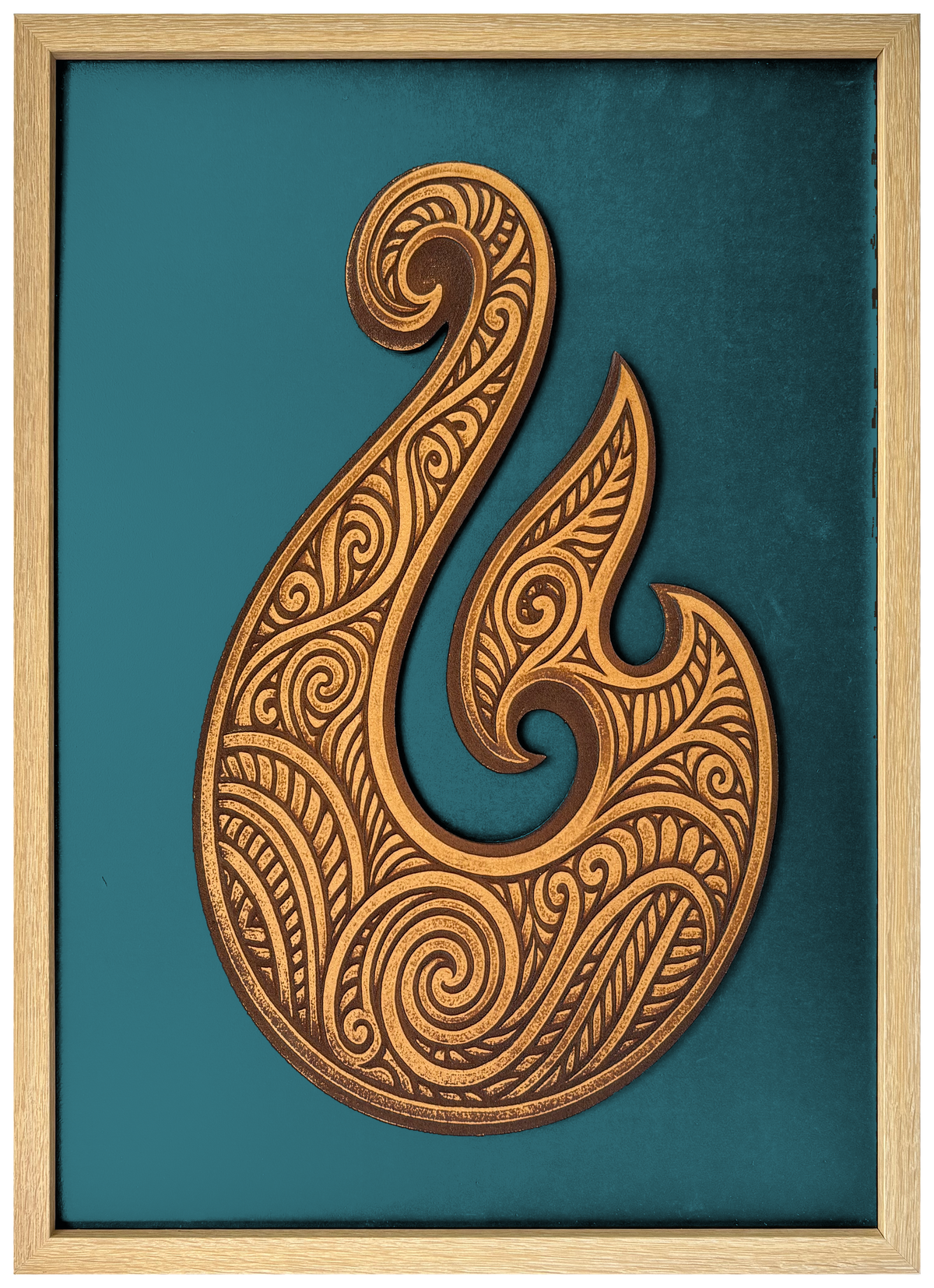 Hei Matou engraved cutout artwork with teal background and Ashwood frame — colour visualisation, not a new photograph.