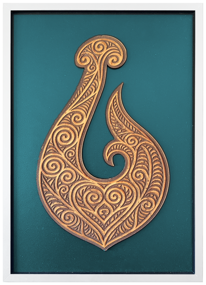 Manaia engraved cutout artwork with teal background and White frame — colour visualisation, not a new photograph.