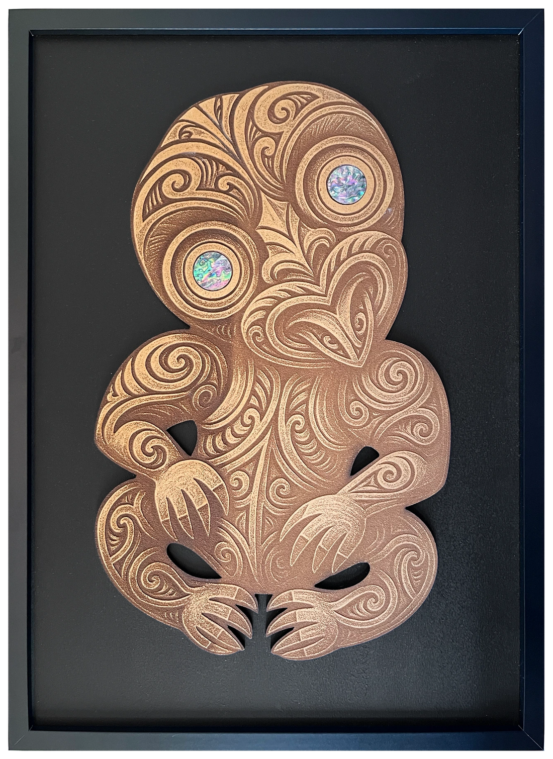 Tiki with pāua eyes, engraved cutout artwork in an A2-size black frame with black background