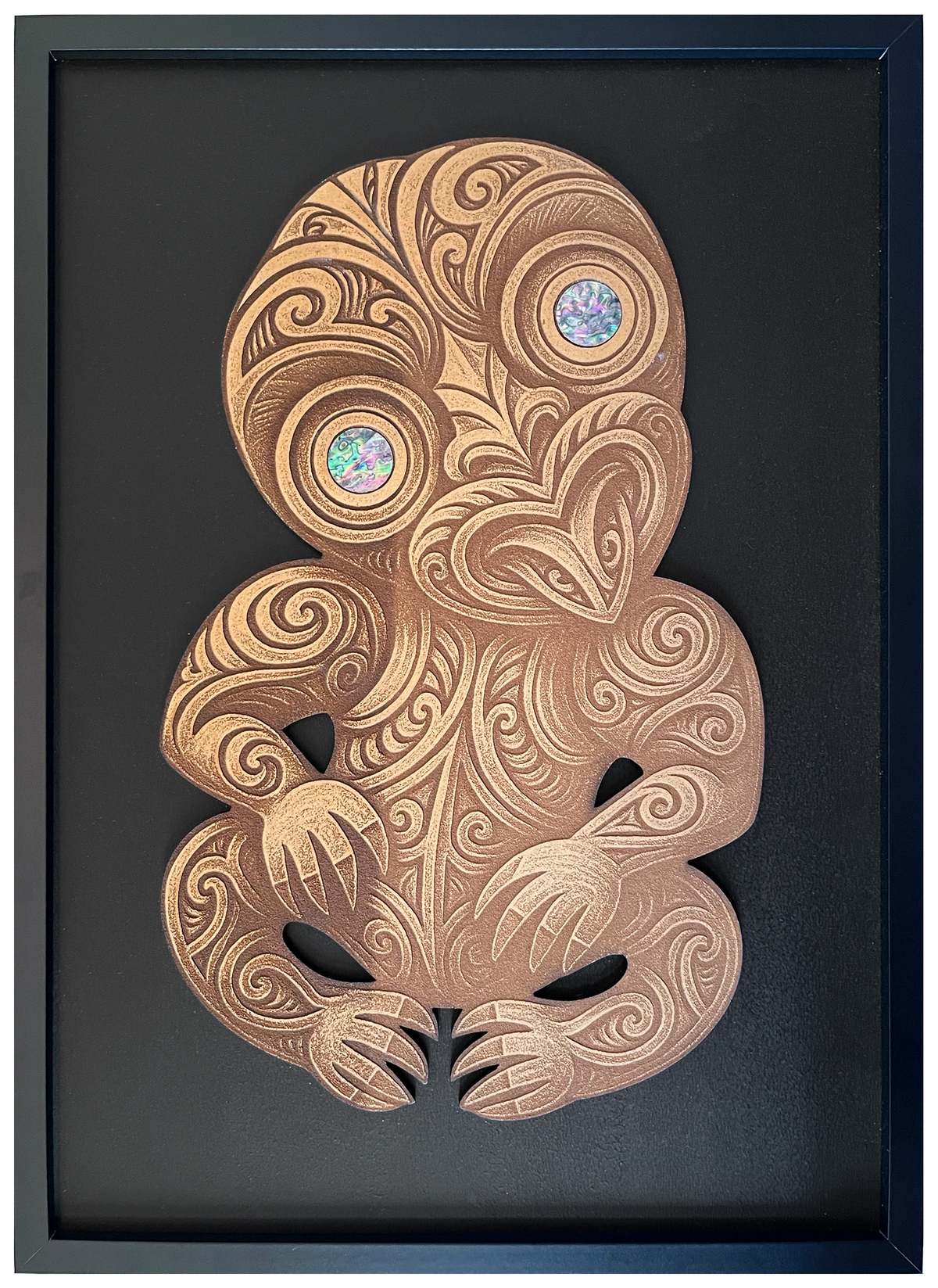 Tiki with pāua eyes, engraved cutout artwork in an A2-size black frame with black background