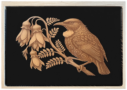 Tūī and Kōwhai engraved cutout artwork with black background and Ashwood frame — frame-finish composite and colour visualisation, not a new photograph.